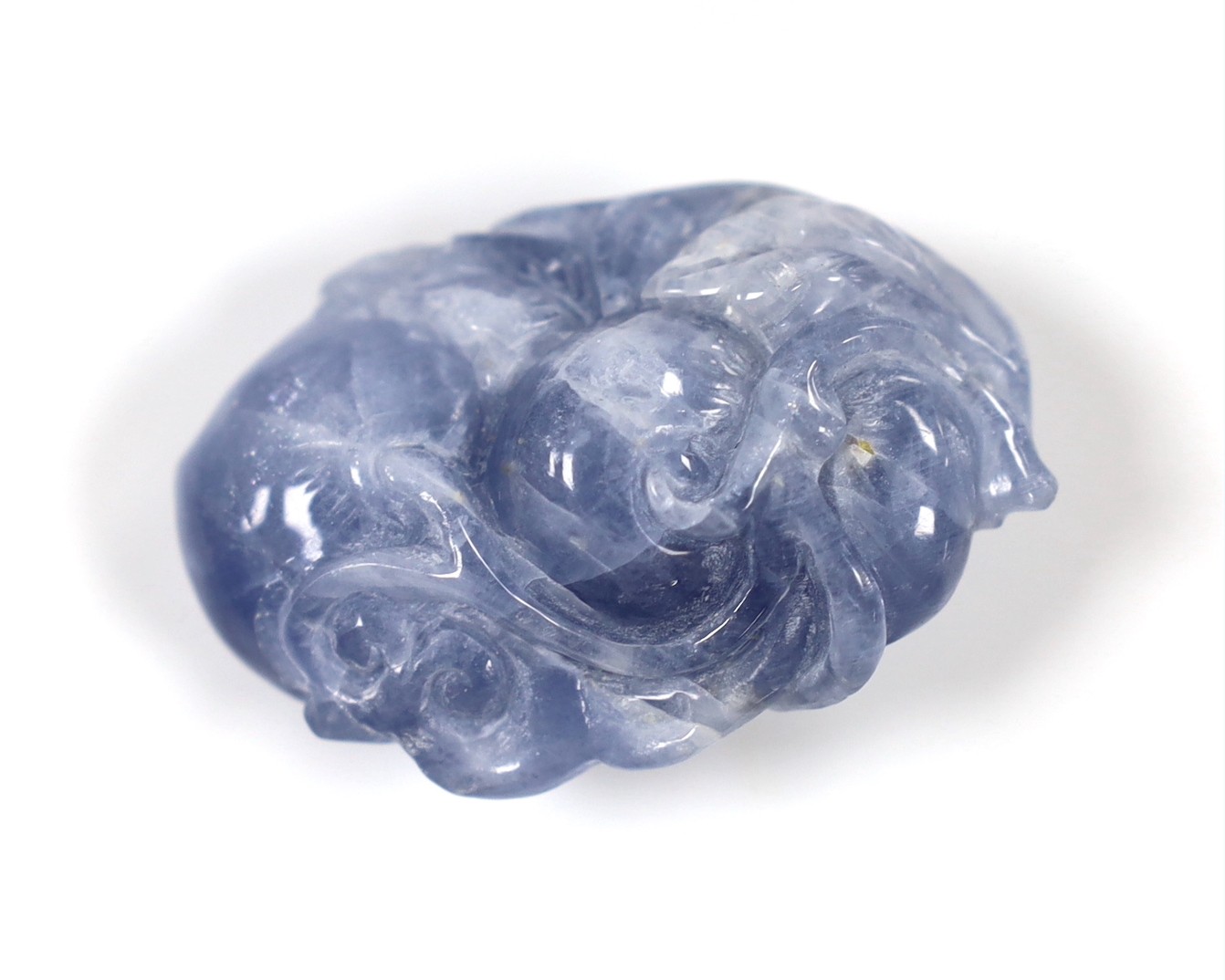 A Nephrite carving of a reading phoenix, 13cm tall, and three other carvings (4)